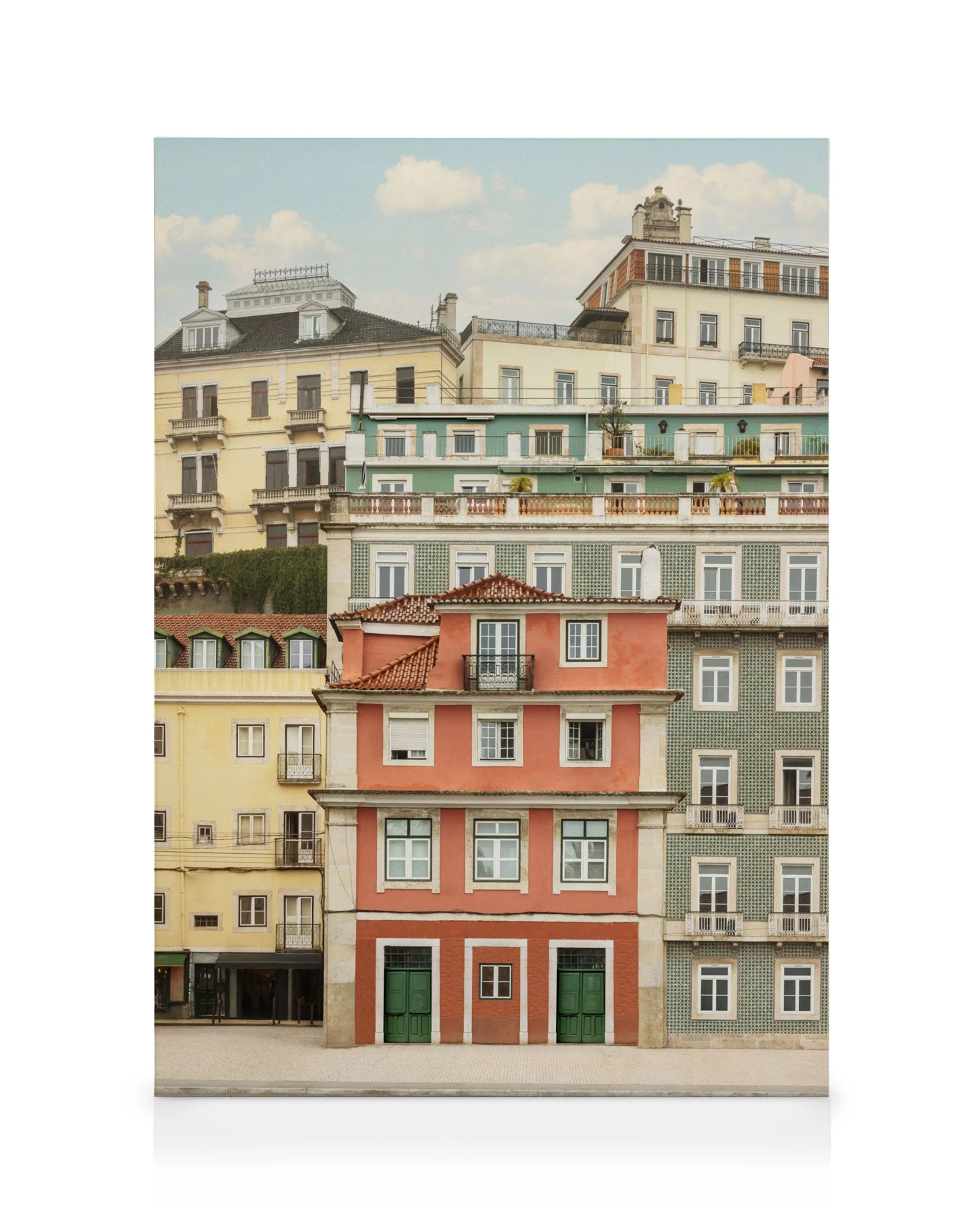 A canvas print showcasing a stack of colourful European apartment buildings in a city, with a red building in the foreground.
