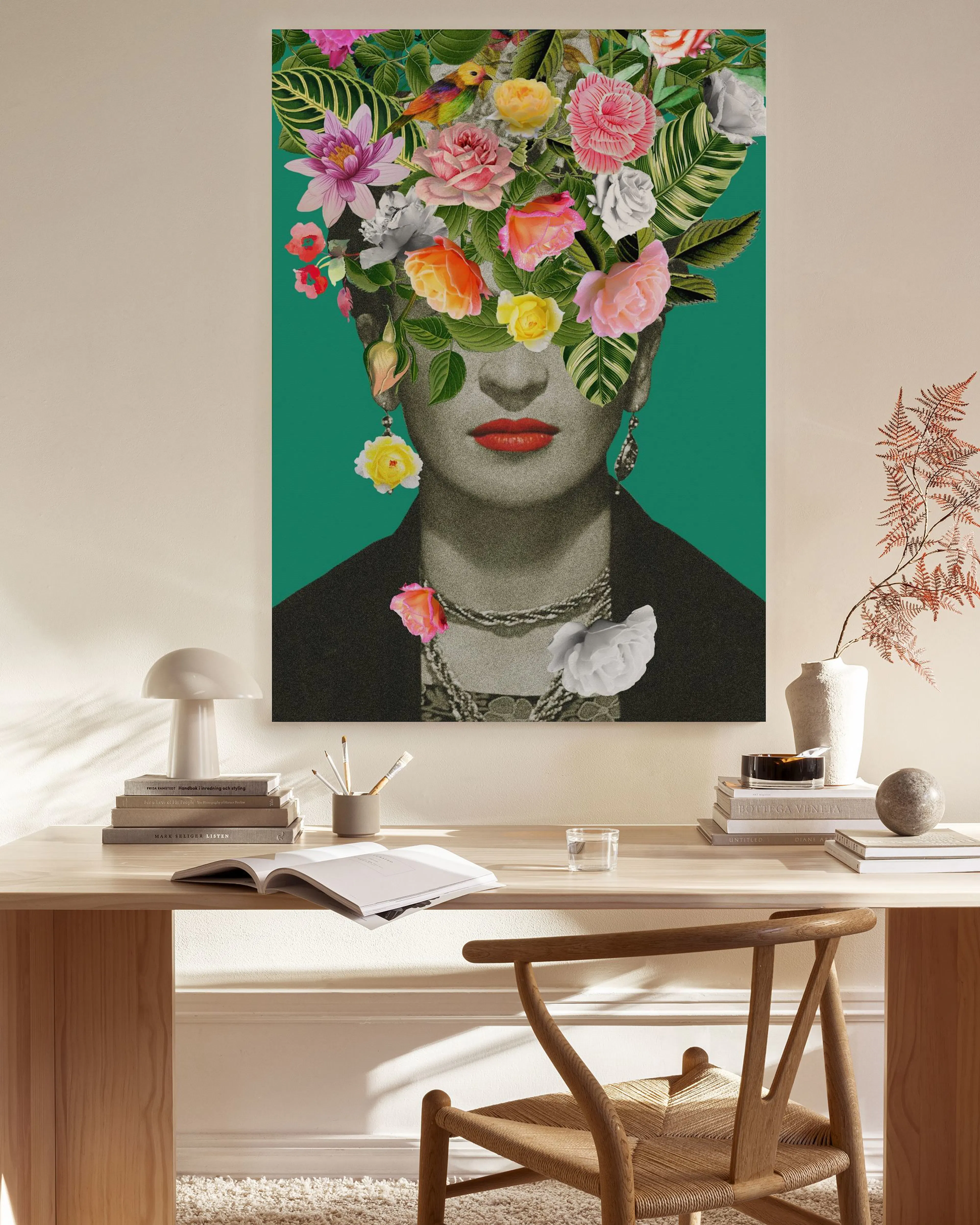 A colorful floral portrait canvas of a woman with flowers covering her face, hanging in a bright living room.