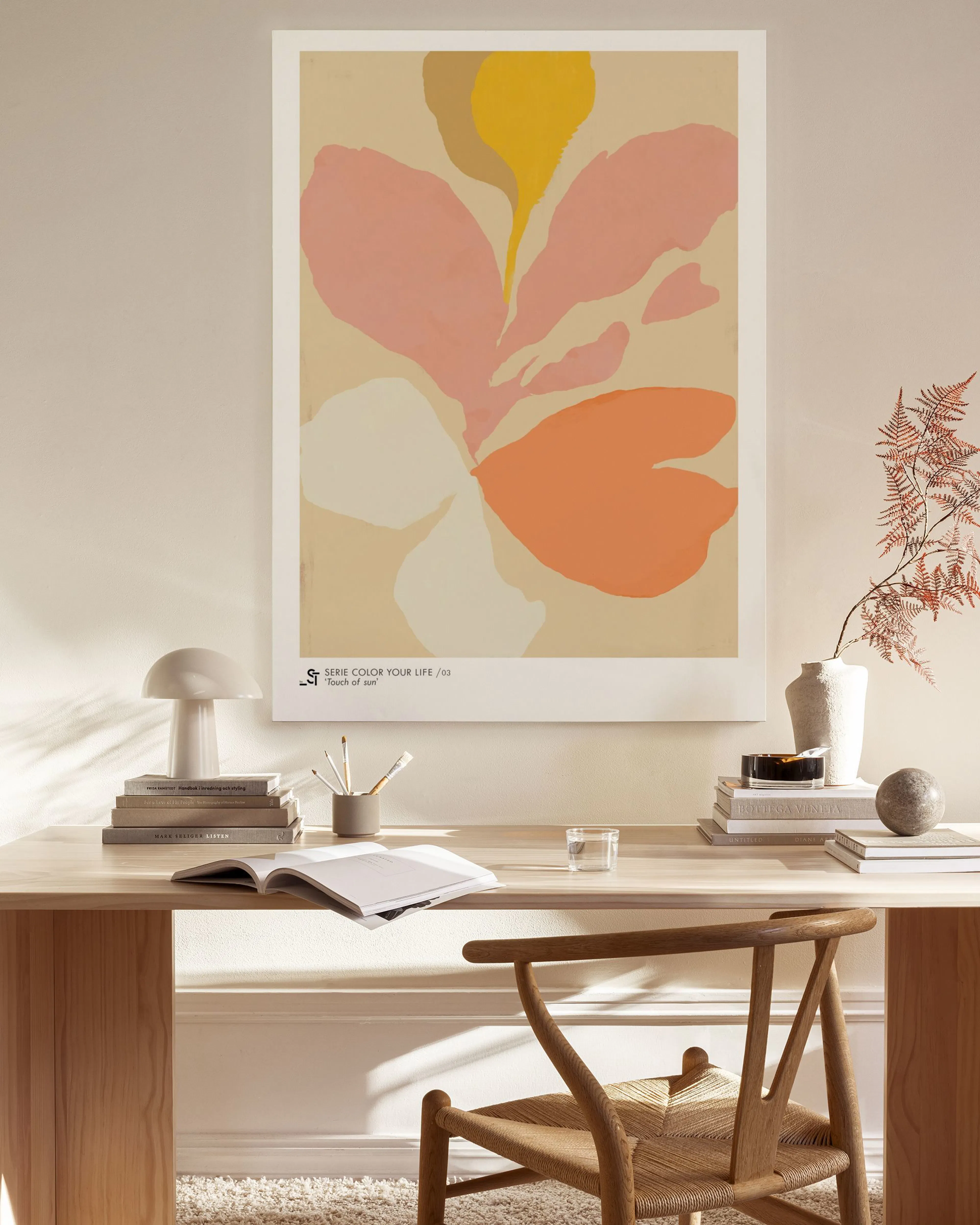 Abstract canvas print with organic shapes in yellow, pink, orange, and white on a beige background.