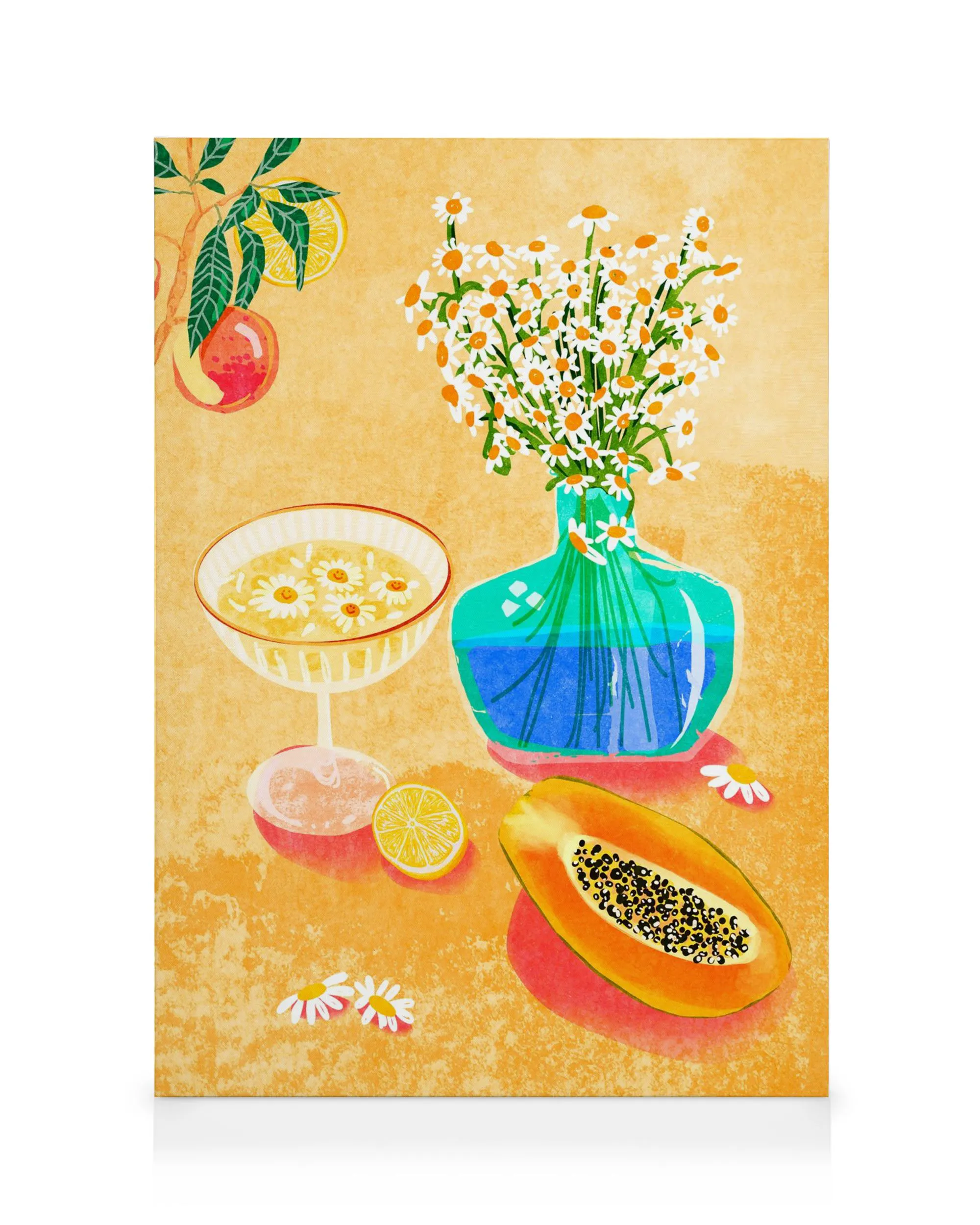 Still life canvas print with orange flowers in a vase, papaya, lemon slice, and floral bowl on yellow.