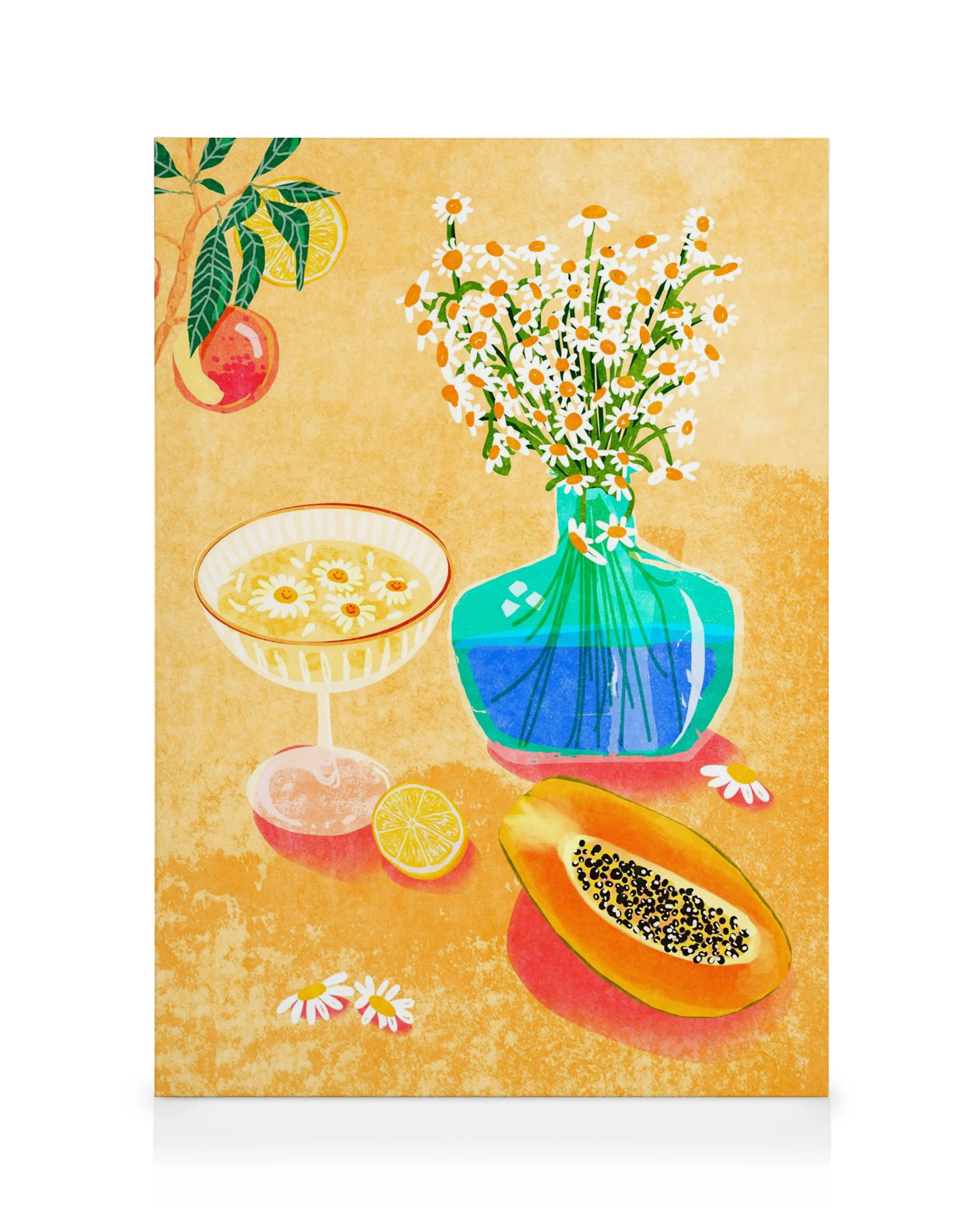 Still life canvas print with orange flowers in a vase, papaya, lemon slice, and floral bowl on yellow.