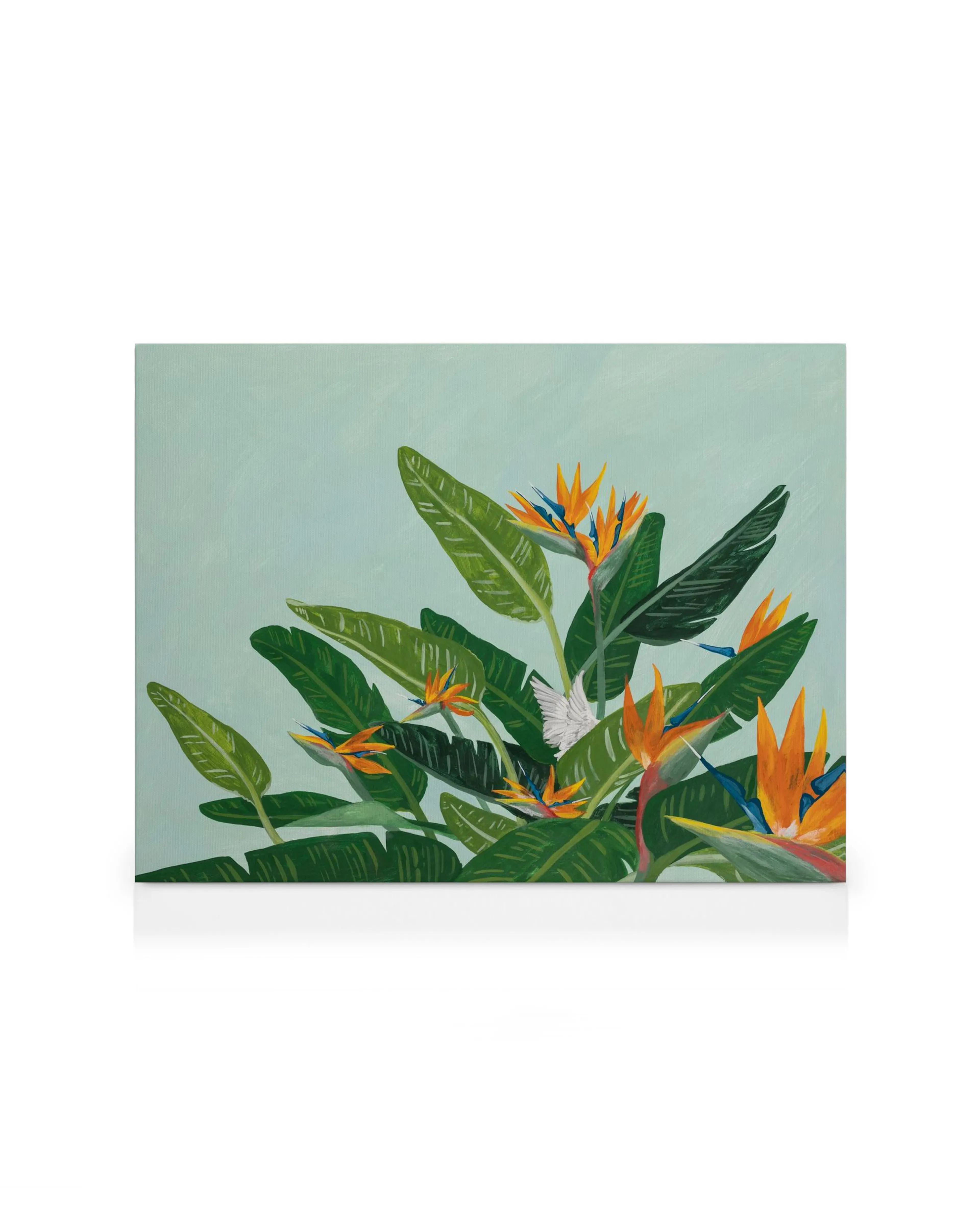 Vibrant canvas art of orange and blue bird of paradise flowers with large green leaves on a pale green background.
