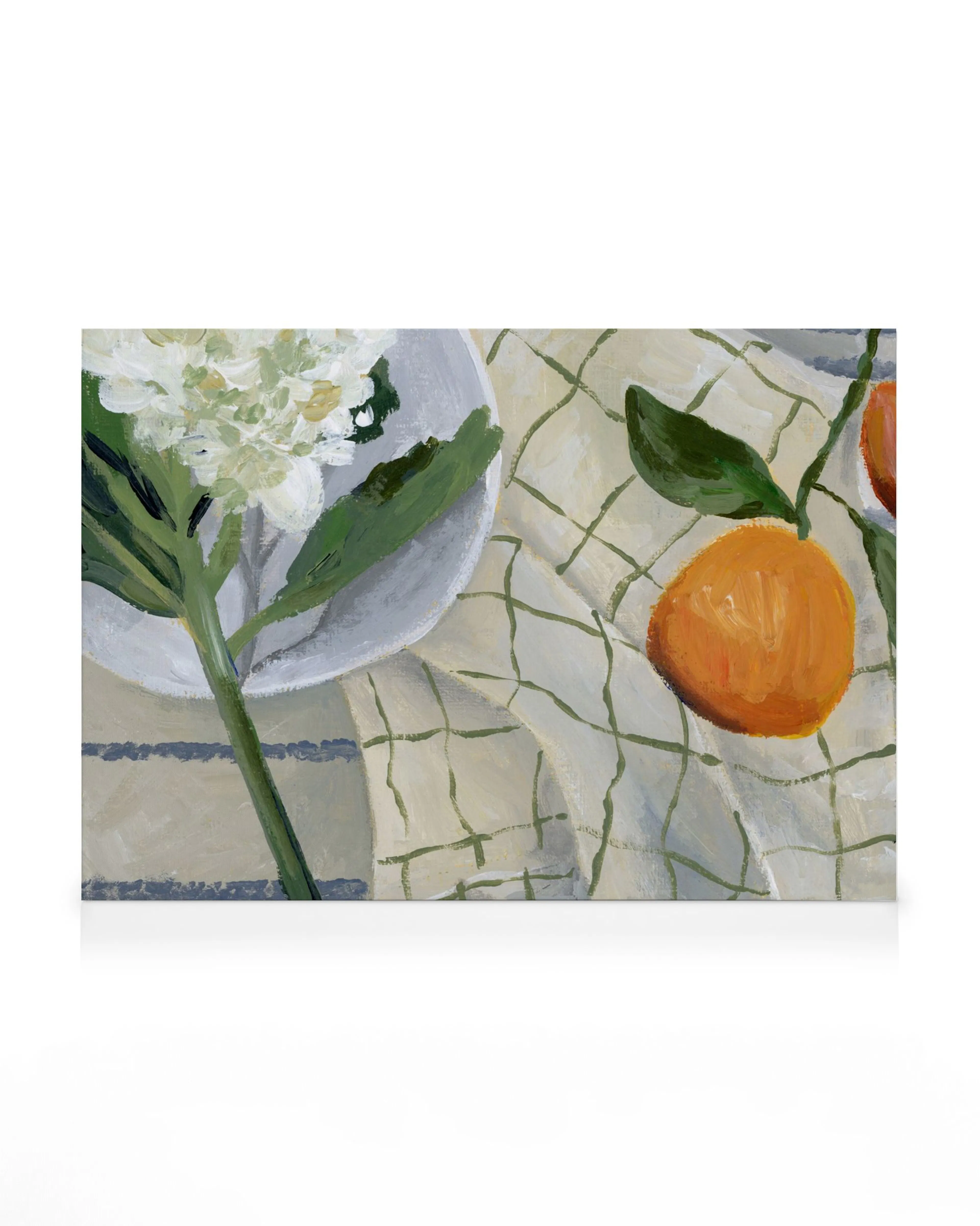 A canvas print of a still life featuring white hydrangea, oranges, and a white checkered tablecloth.