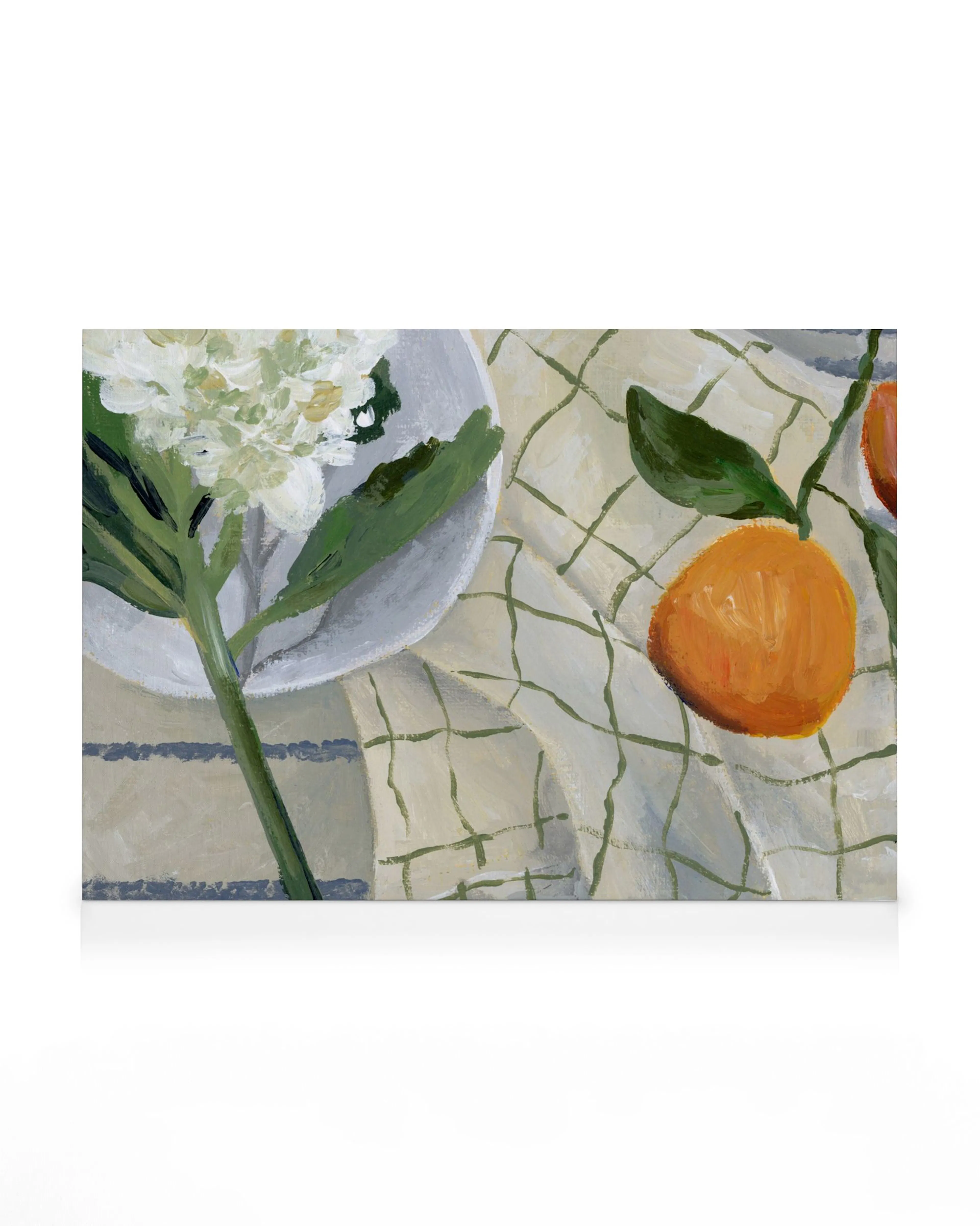 A canvas print featuring a still life painting of white hydrangeas and oranges on a checkered tablecloth.