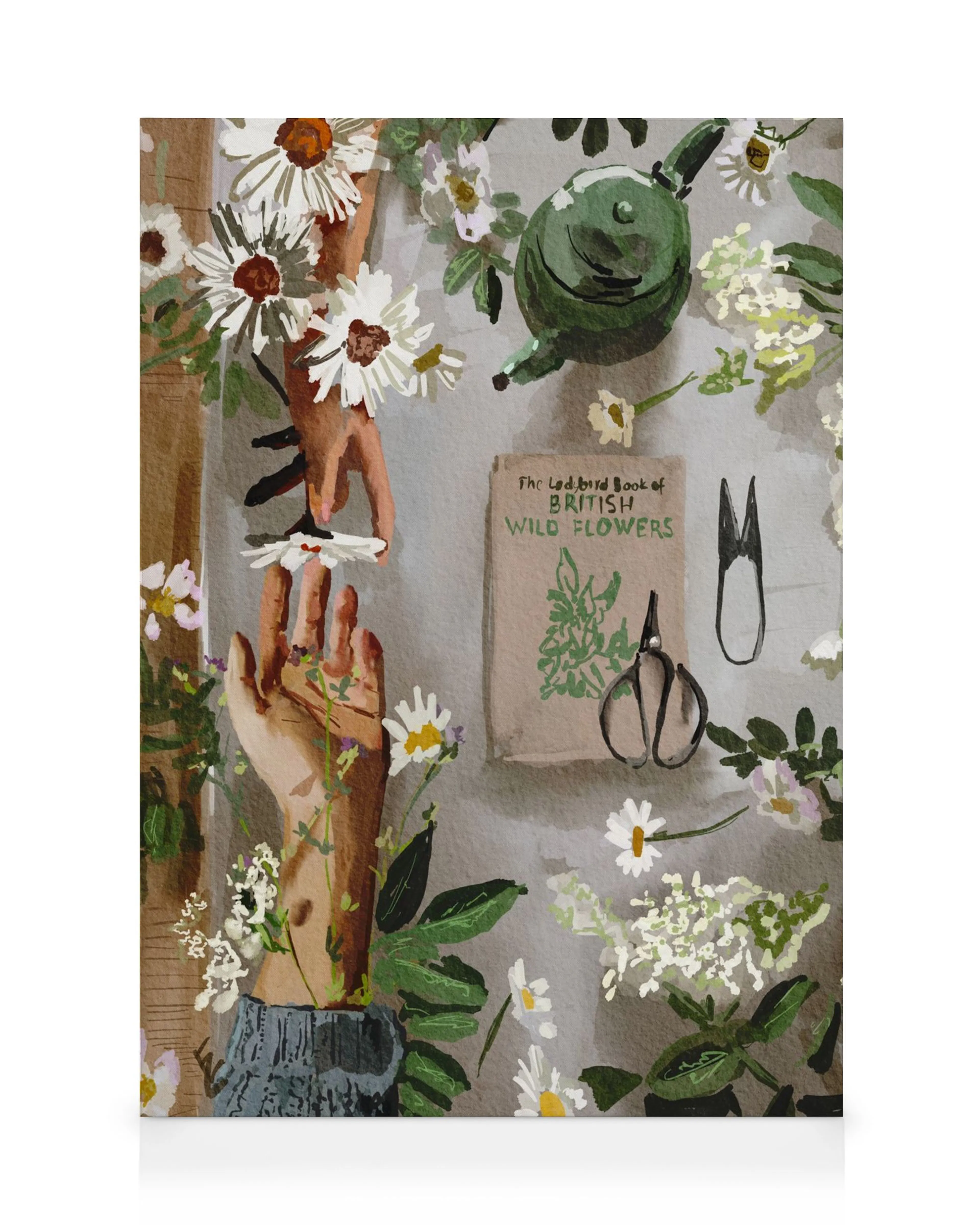 A canvas print featuring two hands holding daisies, with a gardening book, shears, and teapot on a grey background.