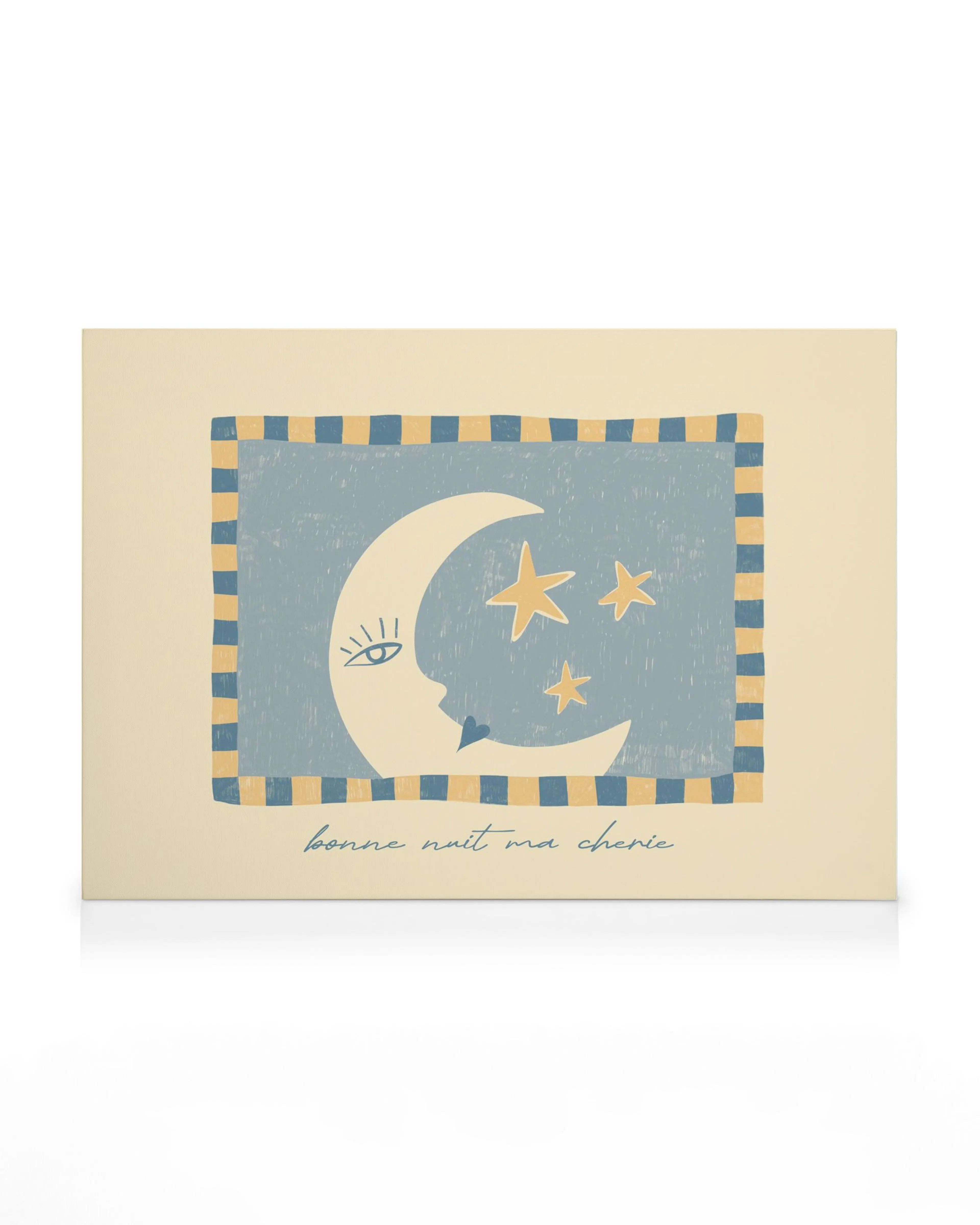 Een canvas met een blauw vlak met een halve maan en sterren, met de tekst ‘bonne nuit ma cherie’.