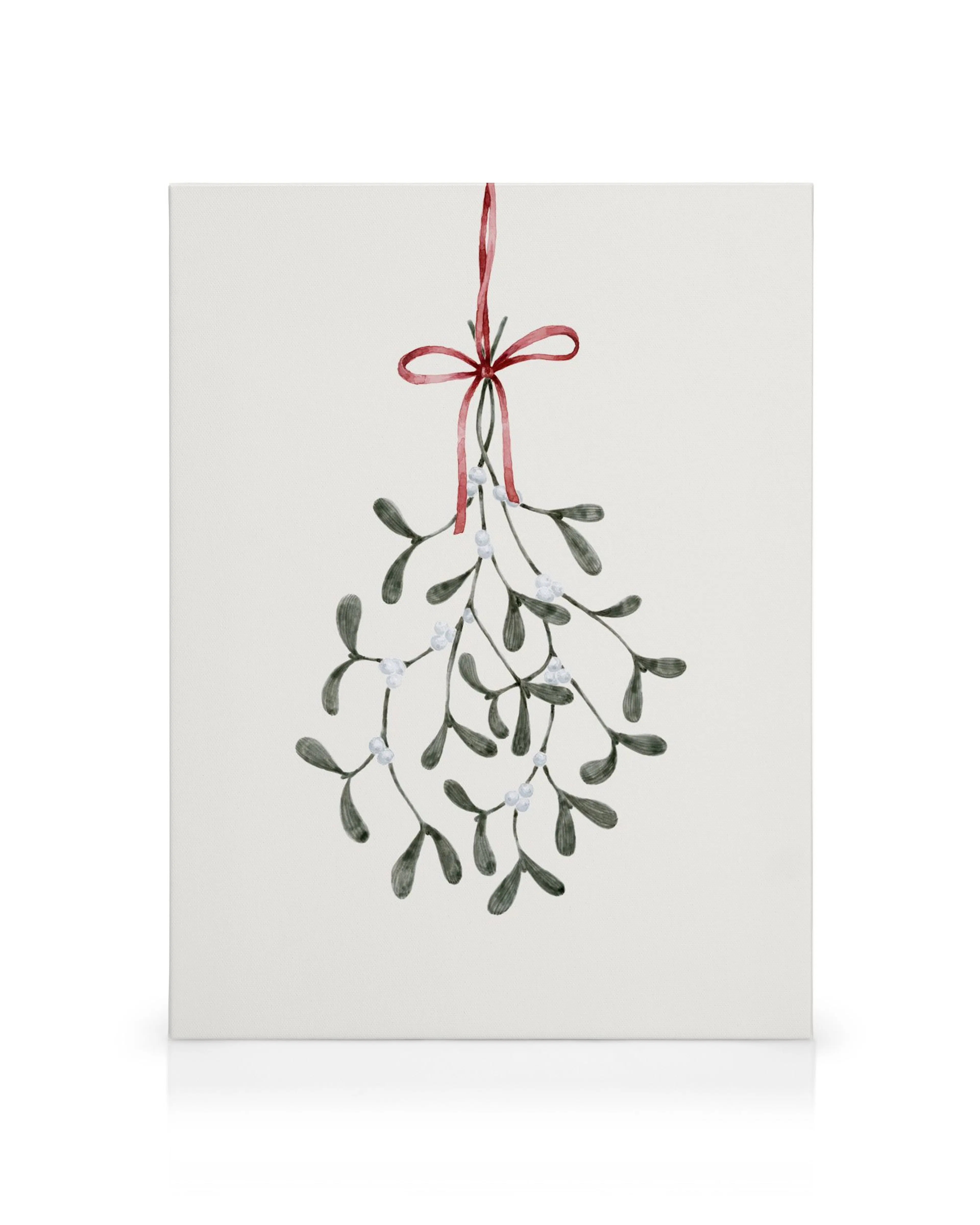 Christmas mistletoe canvas print with watercolor leaves and white berries, tied with a red ribbon and bow.